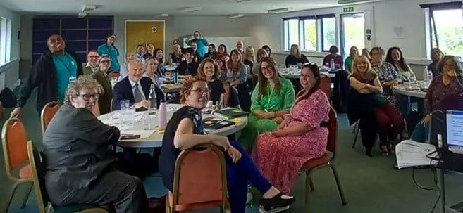 Participants sitting together at co-production event