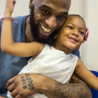 A father holding a child