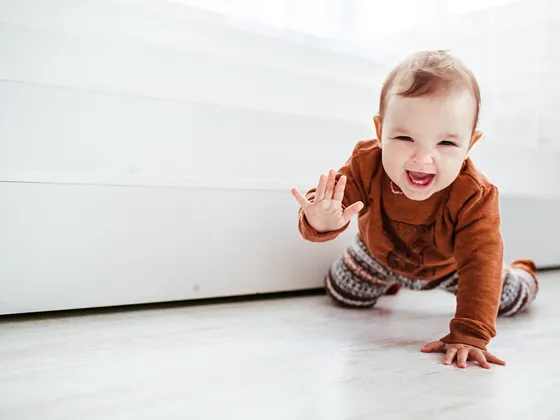Baby crawling and smiling