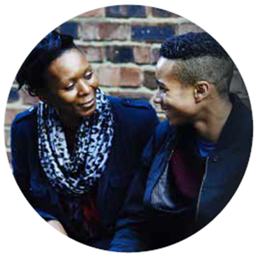 image of young person speaking to an adult